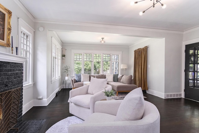 643 Giddings Ave SE, Grand Rapids, MI 49506 - living area featuring a fireplace with flush hearth, dark wood-type flooring, and ornamental molding