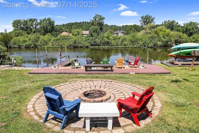 2985 Dana Pointe Dr, Pinckney, MI 48169 - dock with an outdoor fire pit, a yard, and a water view