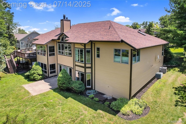2985 Dana Pointe Dr, Pinckney, MI 48169 - rear view of property with a chimney, a lawn, stairs, a deck, and a patio area