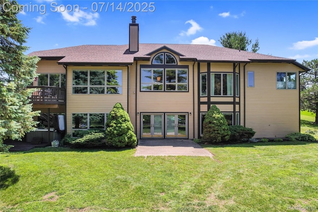 2985 Dana Pointe Dr, Pinckney, MI 48169 - back of property with a lawn, a chimney, french doors, and roof with shingles