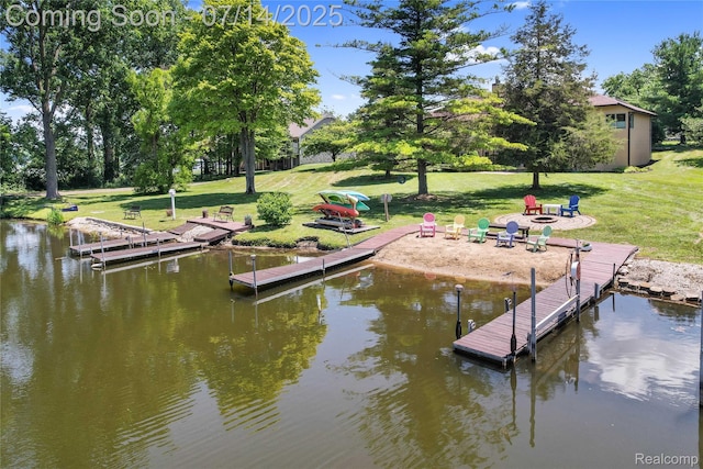 2985 Dana Pointe Dr, Pinckney, MI 48169 - dock with a yard, a water view, and view of scattered trees
