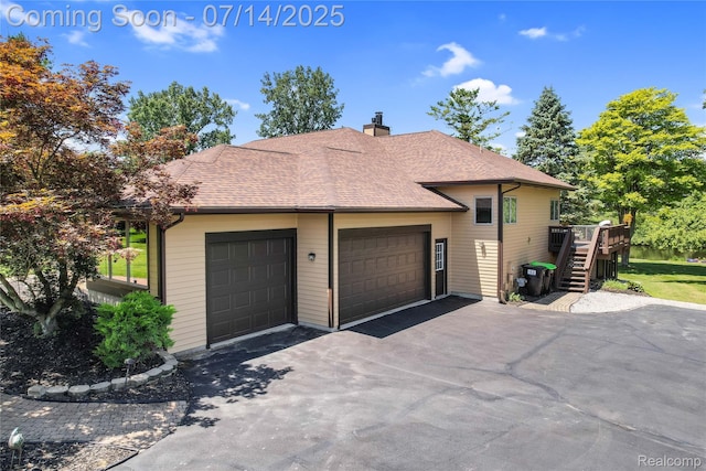 2985 Dana Pointe Dr, Pinckney, MI 48169 - view of side of home featuring a chimney, a deck, driveway, and a shingled roof