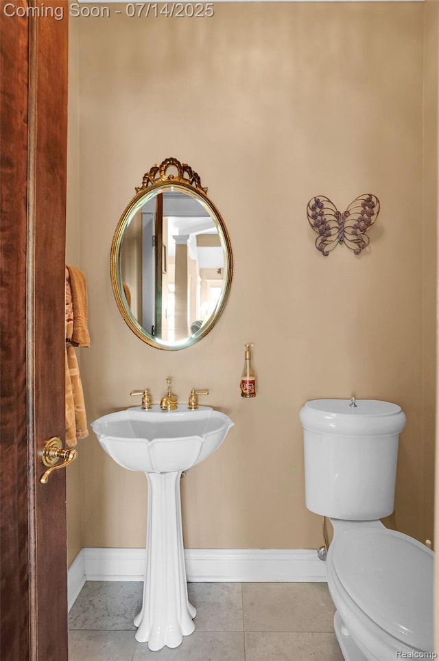 2985 Dana Pointe Dr, Pinckney, MI 48169 - half bathroom with baseboards and tile patterned flooring
