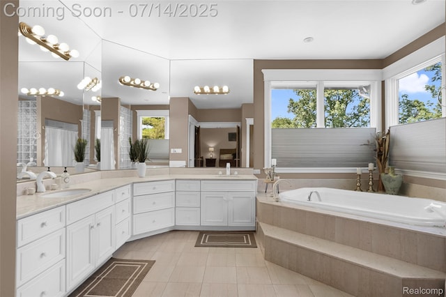 2985 Dana Pointe Dr, Pinckney, MI 48169 - full bathroom featuring plenty of natural light, double vanity, and a bath