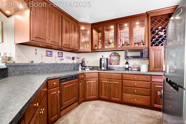 2985 Dana Pointe Dr, Pinckney, MI 48169 - kitchen with freestanding refrigerator, black microwave, paneled dishwasher, glass insert cabinets, and light colored carpet