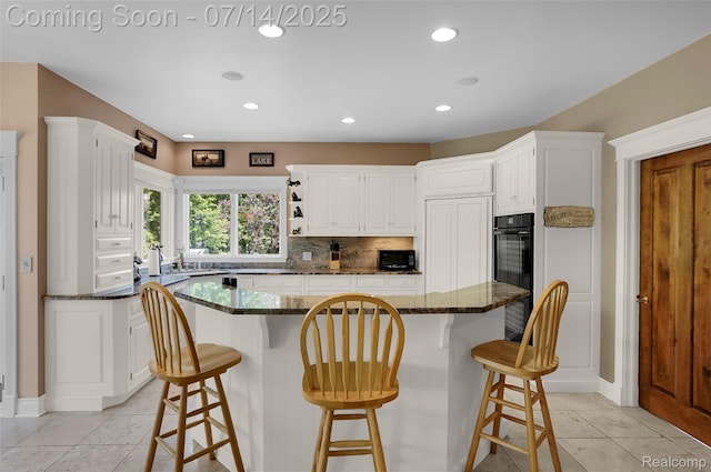 2985 Dana Pointe Dr, Pinckney, MI 48169 - kitchen with light tile patterned floors, white cabinetry, decorative backsplash, and recessed lighting