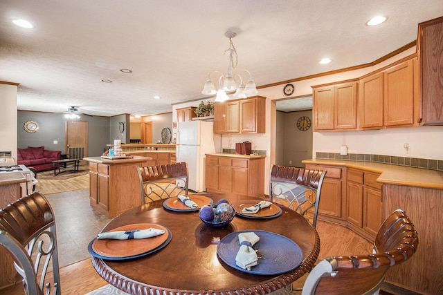 2256 Moulder Dr, Niles, MI 49120 - dining space featuring recessed lighting, light wood finished floors, a ceiling fan, and crown molding