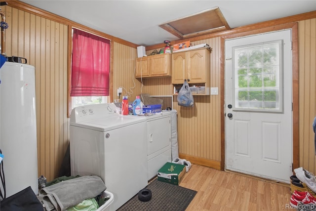1896 Spaulding Rd, Monroe, MI 48162 - laundry area featuring attic access, washer and dryer, cabinet space, wood walls, and light wood-type flooring