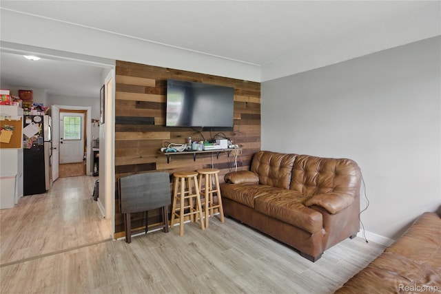 1896 Spaulding Rd, Monroe, MI 48162 - living room featuring wood finished floors and wooden walls