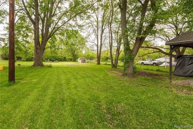 1896 Spaulding Rd, Monroe, MI 48162 - view of green lawn featuring a shed