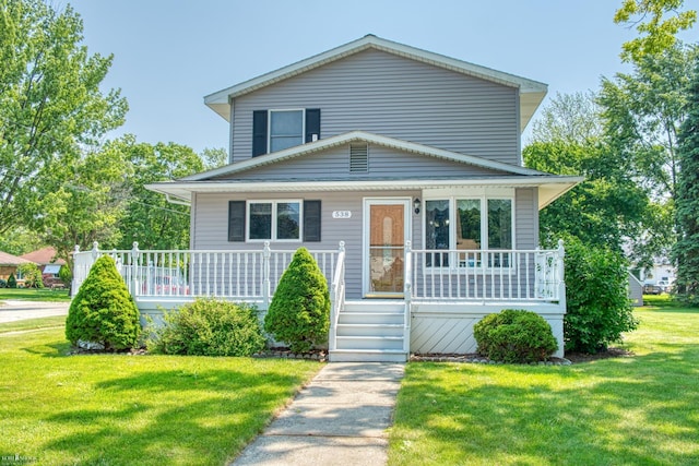 538 Dimmick St, Owosso, MI 48867 - view of front of house with a porch and a front yard