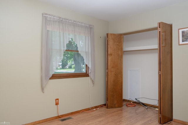 538 Dimmick St, Owosso, MI 48867 - unfurnished bedroom with wood finished floors