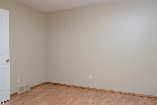 538 Dimmick St, Owosso, MI 48867 - empty room with light wood-type flooring and baseboards