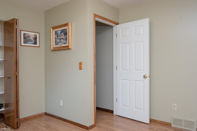 538 Dimmick St, Owosso, MI 48867 - unfurnished bedroom featuring light wood-style flooring and baseboards