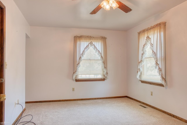 538 Dimmick St, Owosso, MI 48867 - spare room featuring a ceiling fan and carpet flooring