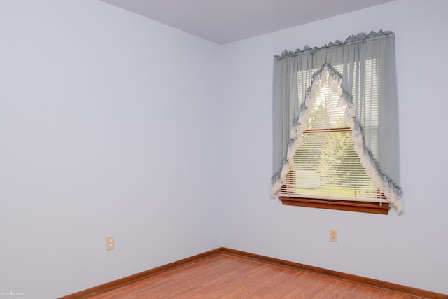 538 Dimmick St, Owosso, MI 48867 - empty room featuring wood finished floors and baseboards