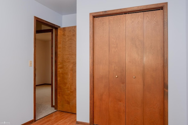 538 Dimmick St, Owosso, MI 48867 - unfurnished bedroom featuring light wood-type flooring and a closet