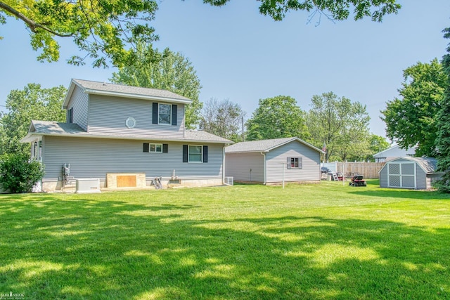 538 Dimmick St, Owosso, MI 48867 - rear view of property featuring a storage unit