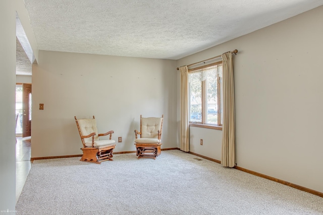 538 Dimmick St, Owosso, MI 48867 - living area featuring carpet, healthy amount of natural light, and a textured ceiling