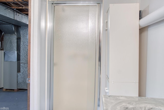538 Dimmick St, Owosso, MI 48867 - bathroom with concrete flooring and a shower stall