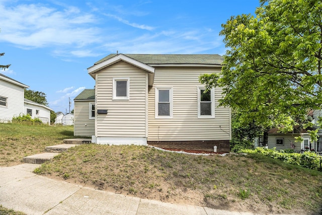 705 E Dowland St, Ludington, MI 49431 - view of front of home featuring a shingled roof