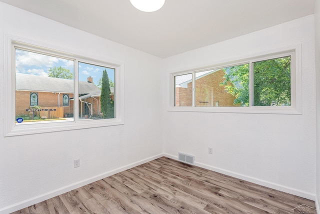 2411 Sheridan Ave, Saginaw, MI 48601 - spare room featuring light wood-type flooring and baseboards