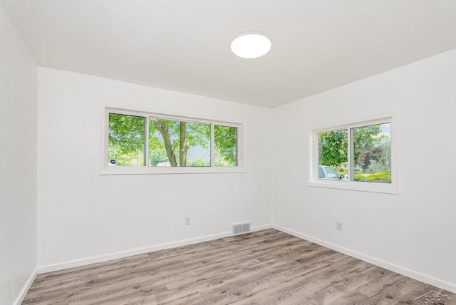 2411 Sheridan Ave, Saginaw, MI 48601 - spare room featuring healthy amount of natural light and light wood-type flooring