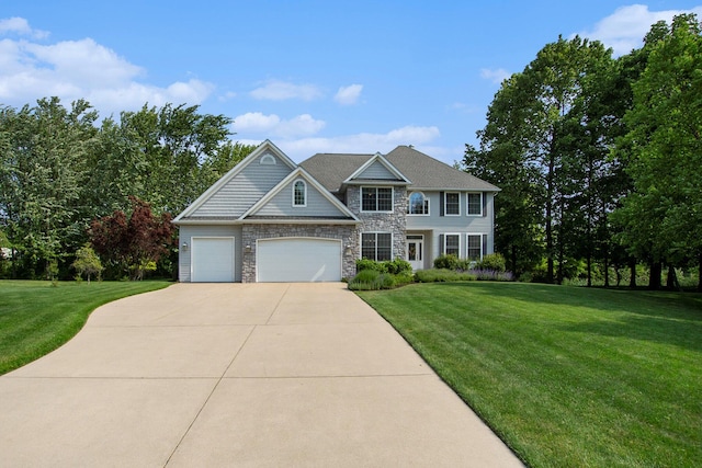 7251 Beverly Dr, South Haven, MI 49090 - view of front of house featuring concrete driveway, a front yard, stone siding, and an attached garage