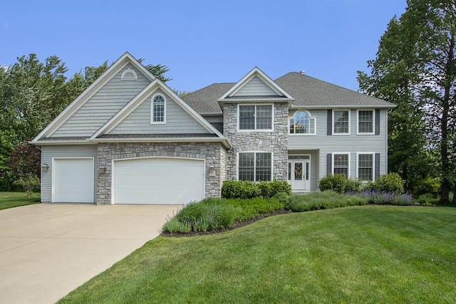 7251 Beverly Dr, South Haven, MI 49090 - view of front facade with driveway, a front yard, stone siding, and an attached garage