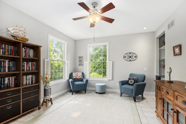 7251 Beverly Dr, South Haven, MI 49090 - sitting room featuring ceiling fan, light tile patterned floors, and built in shelves