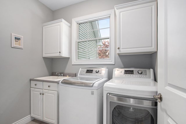 7251 Beverly Dr, South Haven, MI 49090 - laundry room featuring cabinet space and washer and clothes dryer