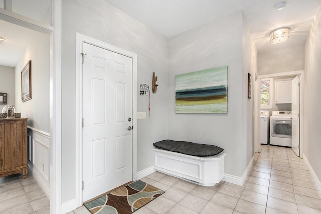 7251 Beverly Dr, South Haven, MI 49090 - foyer entrance with washer and clothes dryer and light tile patterned flooring