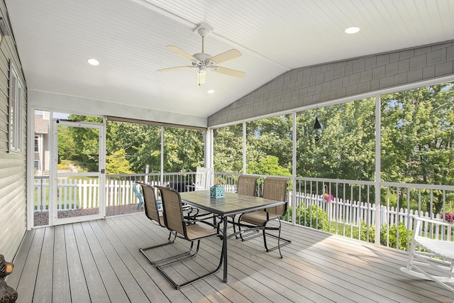 7251 Beverly Dr, South Haven, MI 49090 - sunroom / solarium featuring a ceiling fan, lofted ceiling, outdoor dining area, and view of wooded area