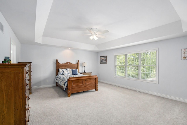 7251 Beverly Dr, South Haven, MI 49090 - bedroom with a raised ceiling, light carpet, and ceiling fan
