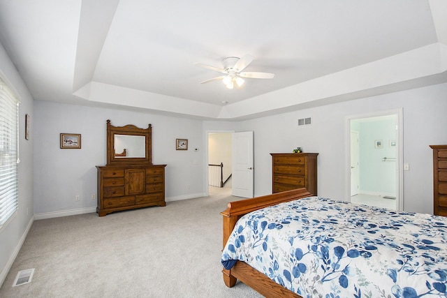 7251 Beverly Dr, South Haven, MI 49090 - bedroom featuring a raised ceiling, light colored carpet, and a ceiling fan