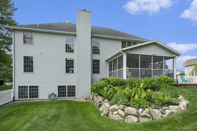 7251 Beverly Dr, South Haven, MI 49090 - rear view of property with a chimney and a sunroom