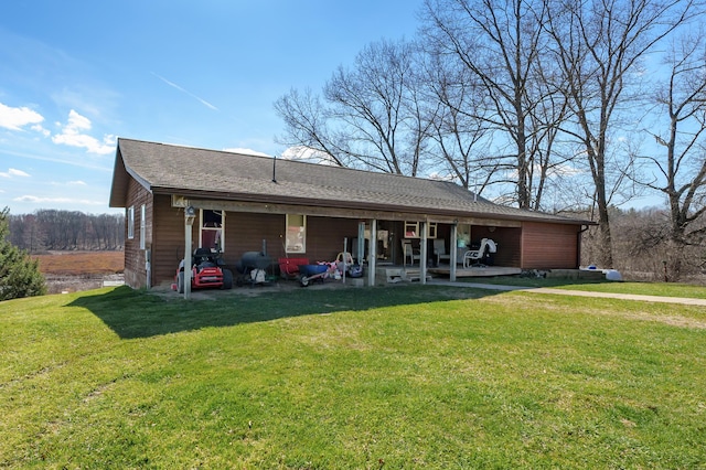 7350 Cedar Creek Rd, Delton, MI 49046 - back of property with a yard and roof with shingles