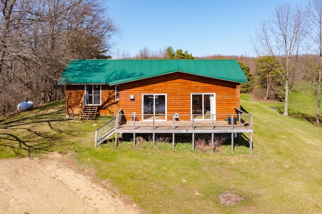 7350 Cedar Creek Rd, Delton, MI 49046 - back of house featuring a deck, a lawn, and a metal roof
