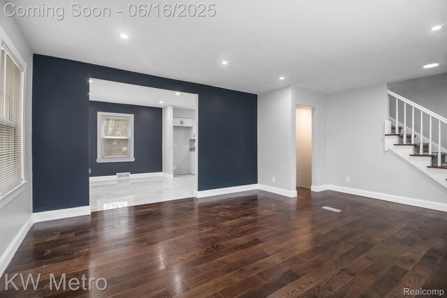 18504 Sussex St, Detroit, MI 48235 - unfurnished living room featuring wood finished floors, stairway, and recessed lighting