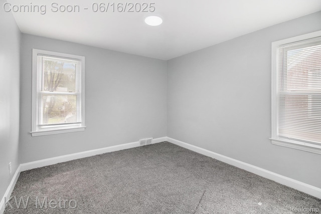 18504 Sussex St, Detroit, MI 48235 - carpeted empty room with baseboards