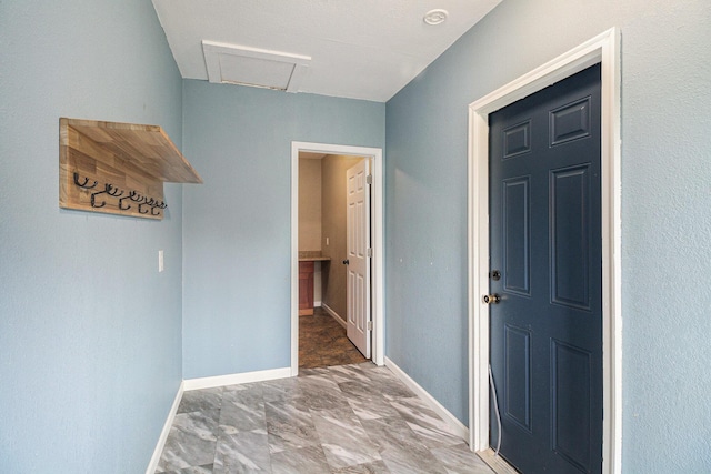 8175 Chamberlin Rd, Dexter, MI 48130 - hallway with attic access and marble look tile flooring