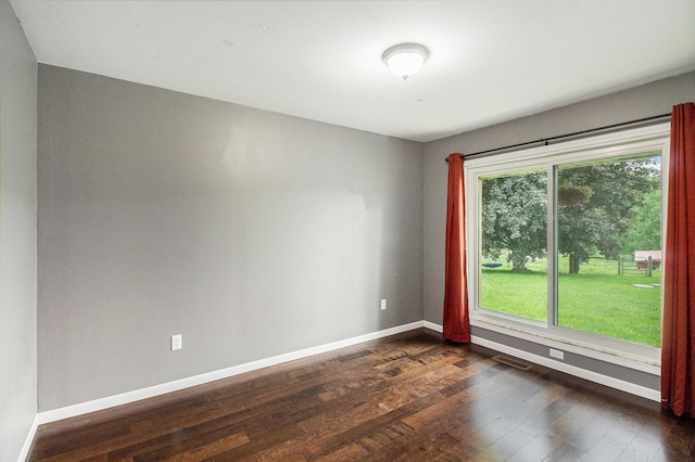 8175 Chamberlin Rd, Dexter, MI 48130 - empty room featuring baseboards and dark wood-style flooring