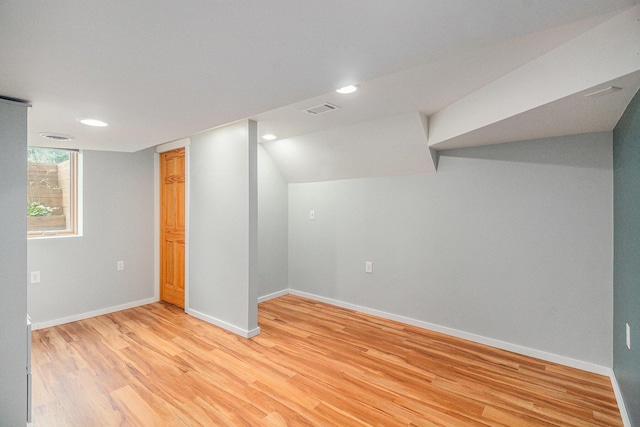 8175 Chamberlin Rd, Dexter, MI 48130 - below grade area featuring light wood finished floors and recessed lighting