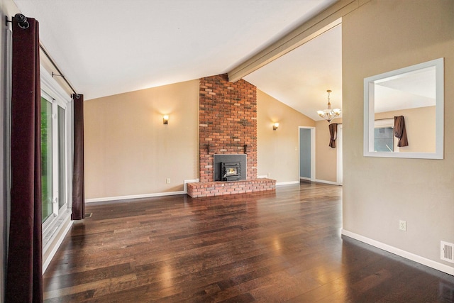 8175 Chamberlin Rd, Dexter, MI 48130 - unfurnished living room featuring a chandelier, dark wood-style flooring, plenty of natural light, and a fireplace