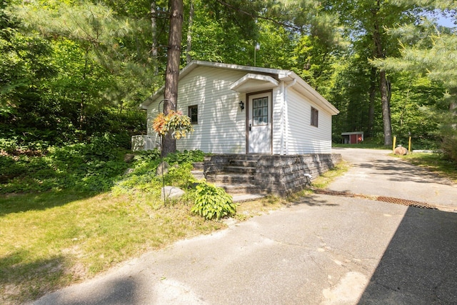6860 Ashley Ave NE, Belding, MI 48809 - view of front facade with driveway