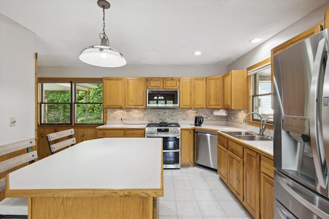 6860 Ashley Ave NE, Belding, MI 48809 - kitchen featuring appliances with stainless steel finishes, light countertops, healthy amount of natural light, and recessed lighting