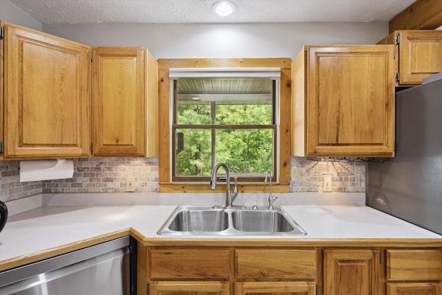 6860 Ashley Ave NE, Belding, MI 48809 - kitchen featuring stainless steel dishwasher, light countertops, and decorative backsplash