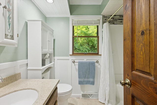 6860 Ashley Ave NE, Belding, MI 48809 - bathroom featuring vanity, a wainscoted wall, and a decorative wall