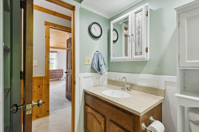 6860 Ashley Ave NE, Belding, MI 48809 - bathroom with a wainscoted wall and vanity