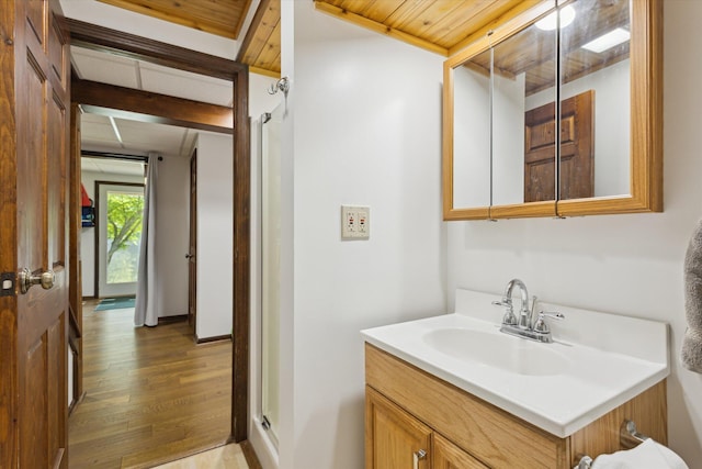 6860 Ashley Ave NE, Belding, MI 48809 - bathroom with wood finished floors and vanity